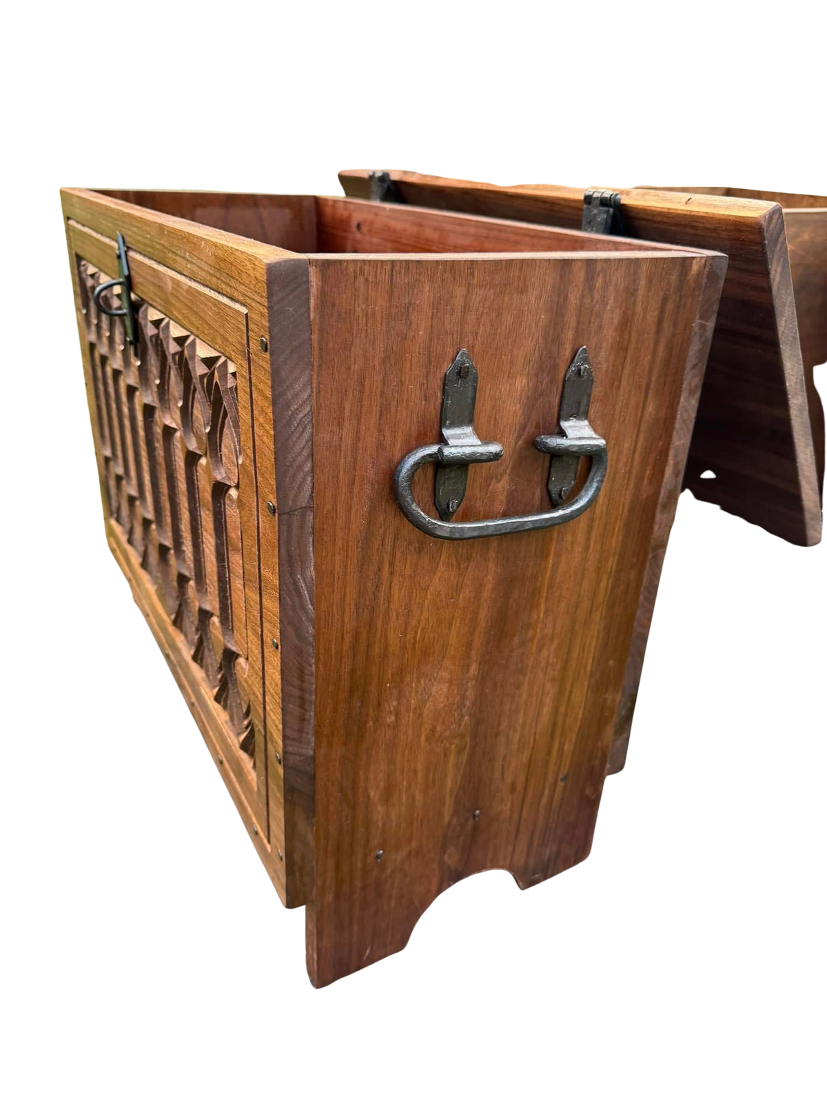 A carved gothic style wooden chest with hand forged hardware.